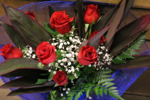 Red Roses Long Stem with Leather Fern, Baby Breath/Tea Tree, wrapped in Royal Blue Mesh $55.00